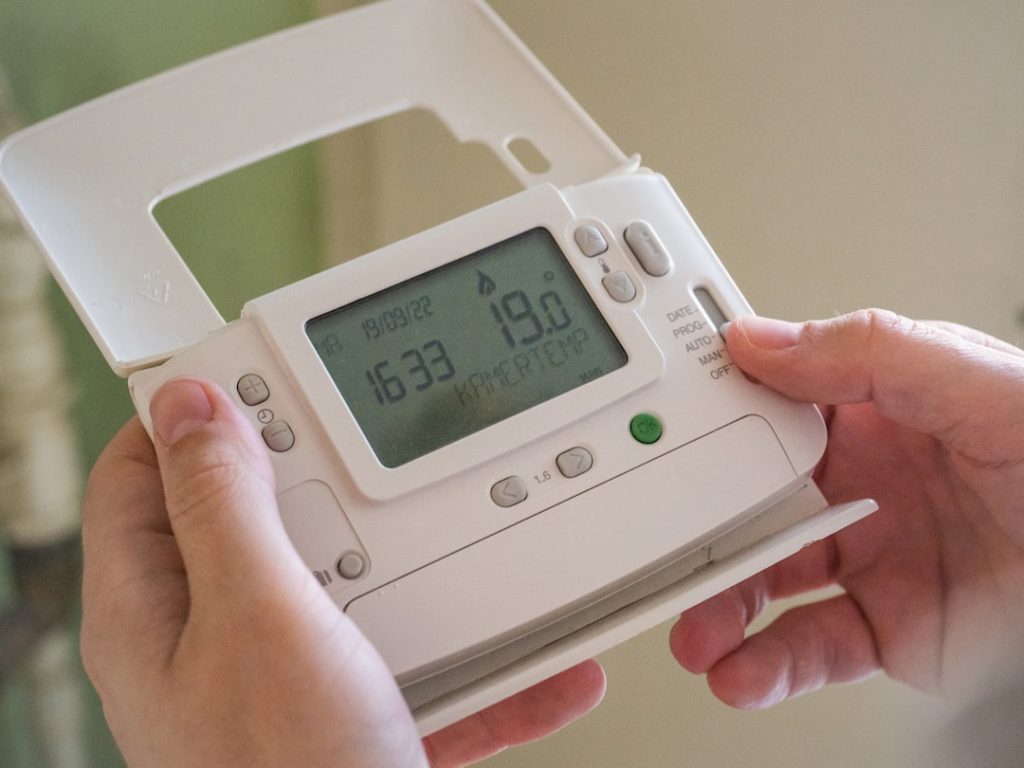 a-person-holding-a-device-yg19gb9jw0i